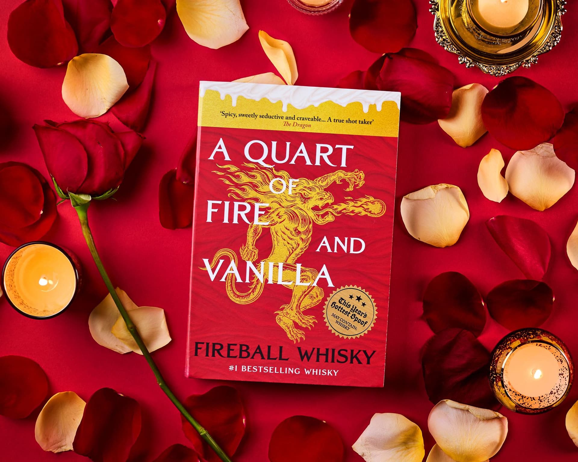 The Smut Stash cover, A Quart of Fire and Vanilla, surrounded by rose petals and candles
