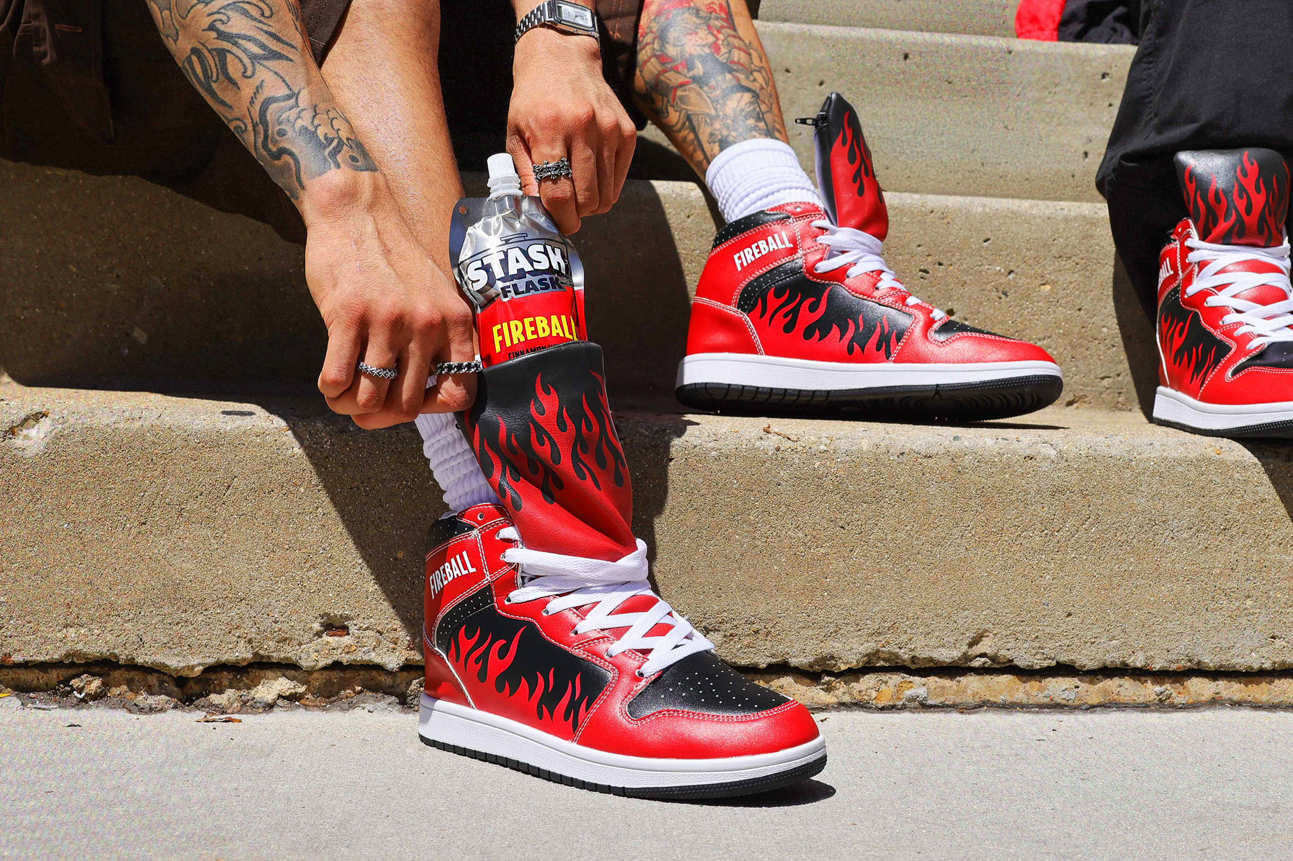 Pulling the Stash Flask from a Fireball Sneaker on the steps