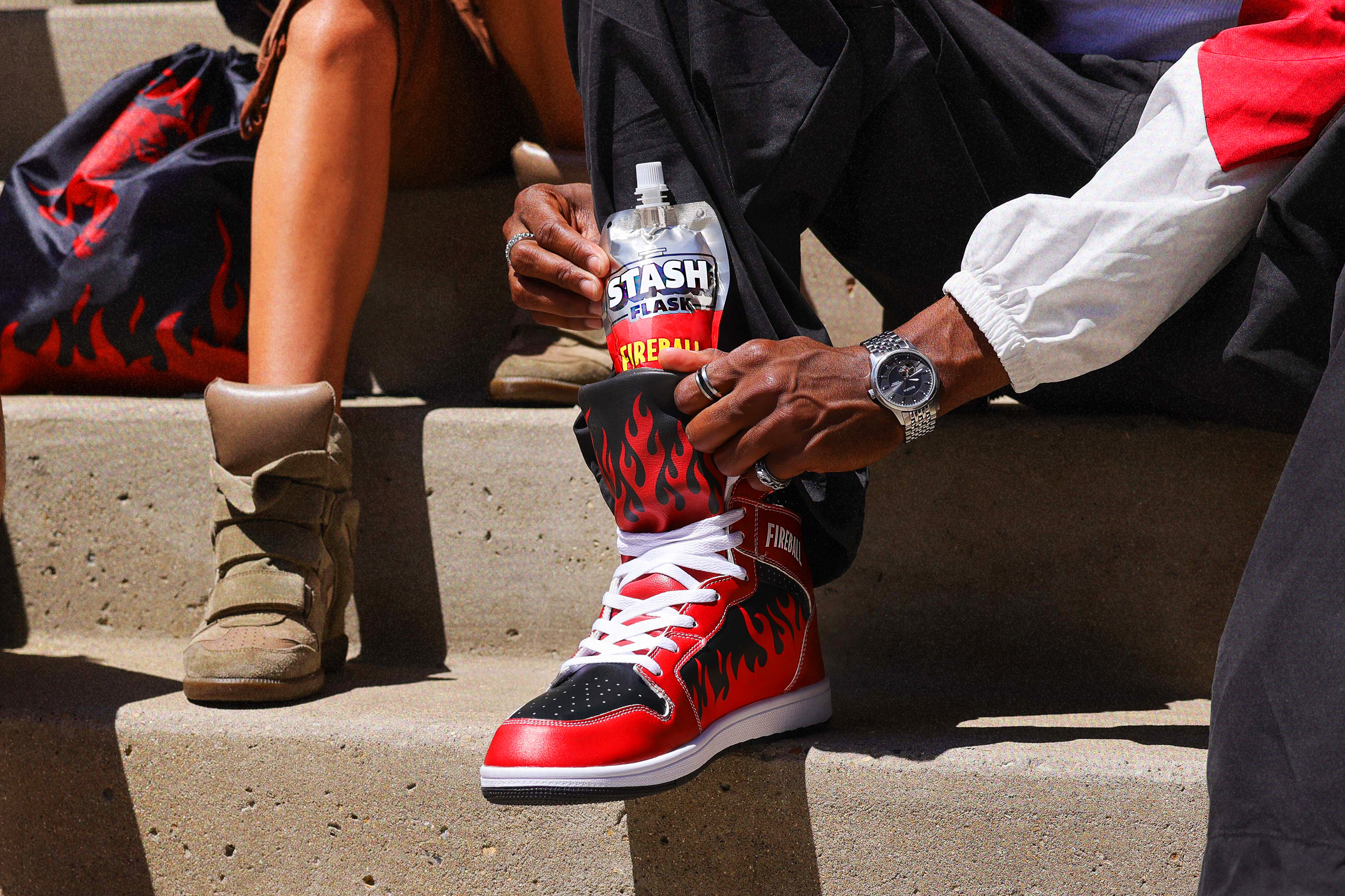 Friends hanging out with Fireball Sneaks and the flame drawstring bag