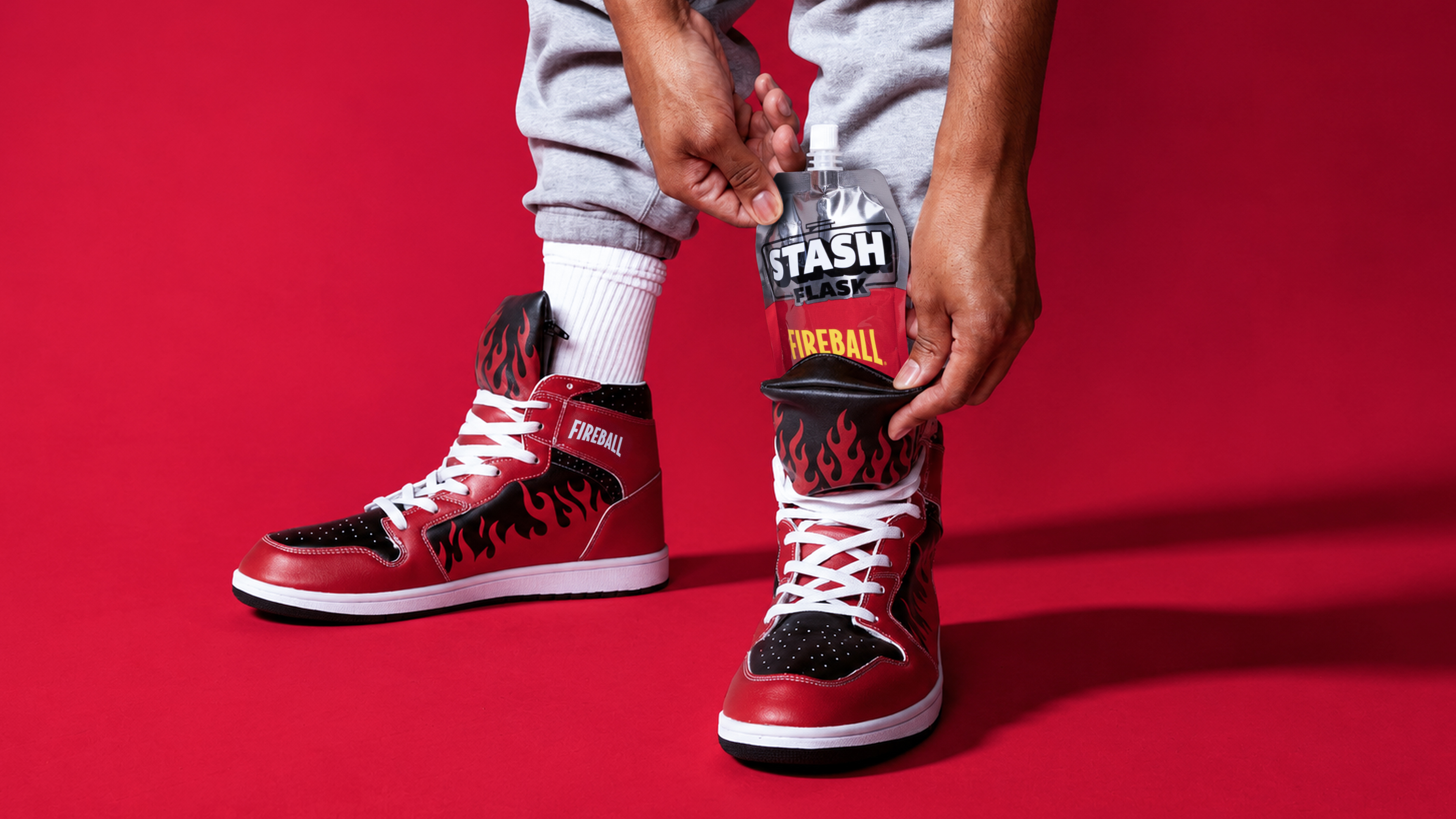 Sliding the Fireball Stash Flask into the sneaker's tongue pocket