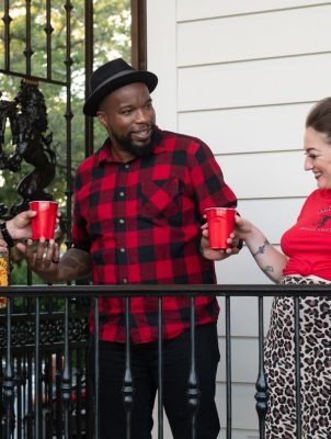 Man in flannel fireball shirt with friends