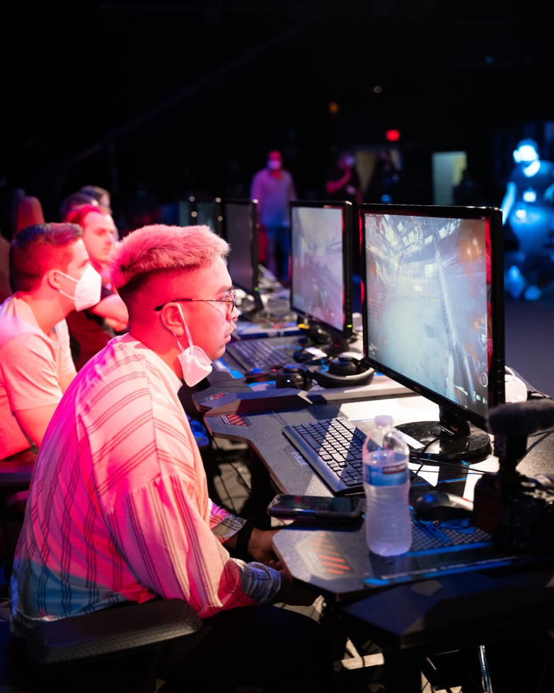 Gamers sitting at gaming stations