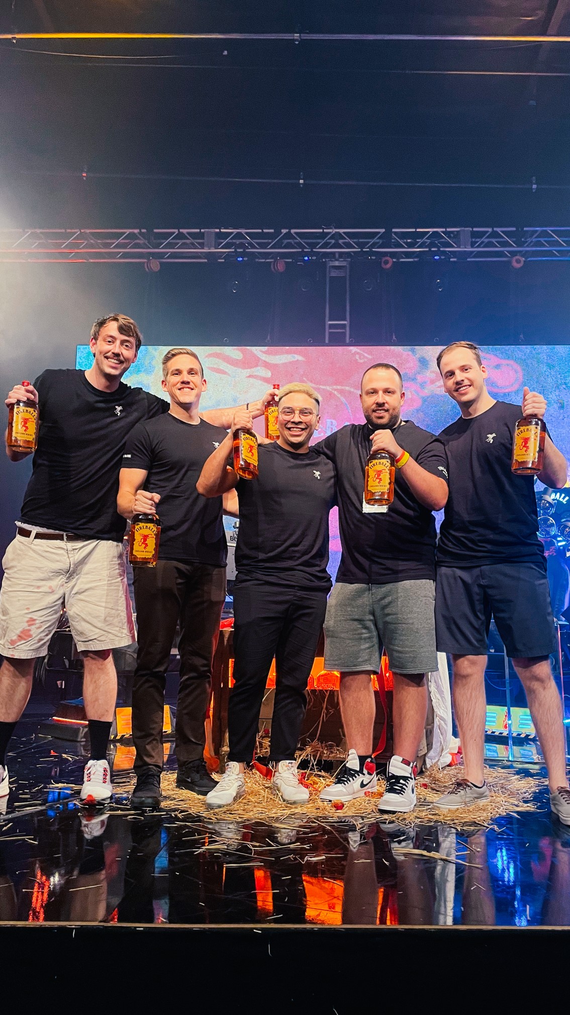 Black Ice Team on game stage with bottles of Fireball